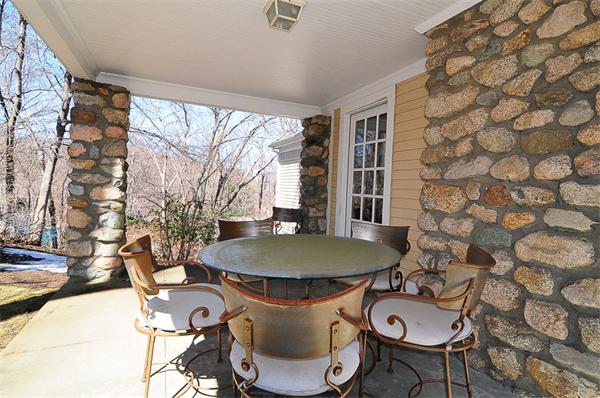 62 Fiske Road Wellesley, MA 02481 - Photo 20 of 25 a table and chairs in a patio