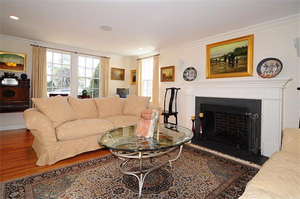 62 Fiske Road Wellesley, MA 02481 - Photo 8 of 25 a living room with furniture a table and a fireplace
