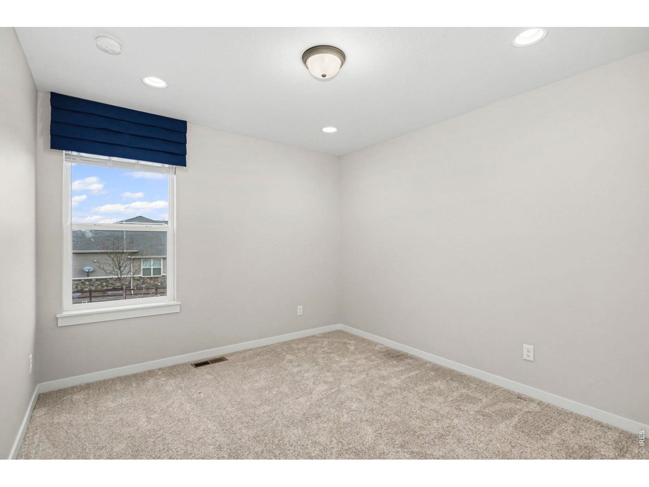 2124 Glean Court Windsor, CO 80550 - Photo 20 of 40 a view of an empty room with a window