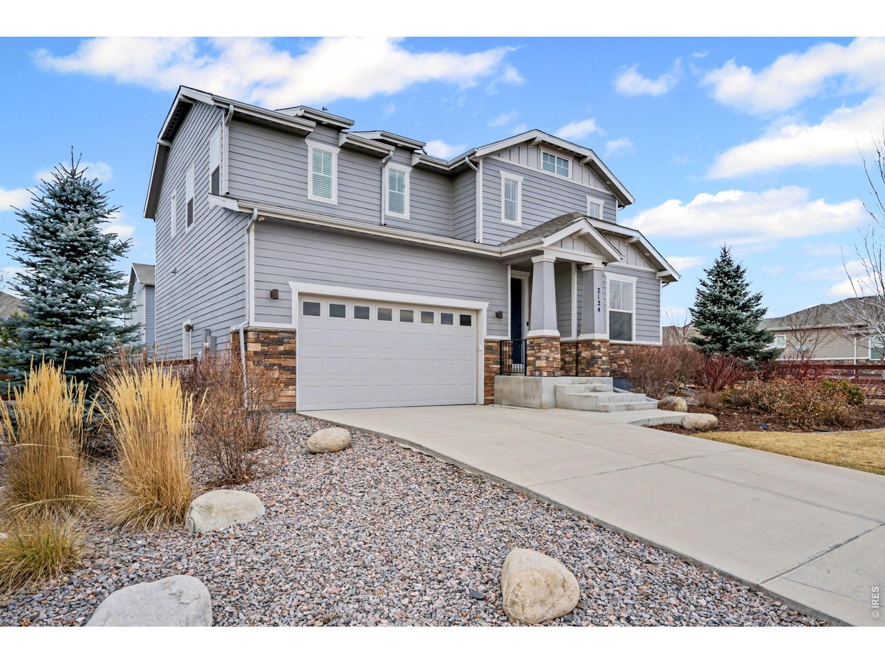 2124 Glean Court Windsor, CO 80550 - Photo 2 of 40 a view of a house with a yard