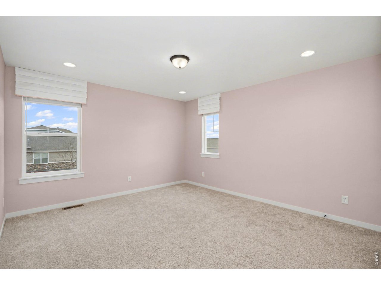 2124 Glean Court Windsor, CO 80550 - Photo 22 of 40 a view of an empty room with a window