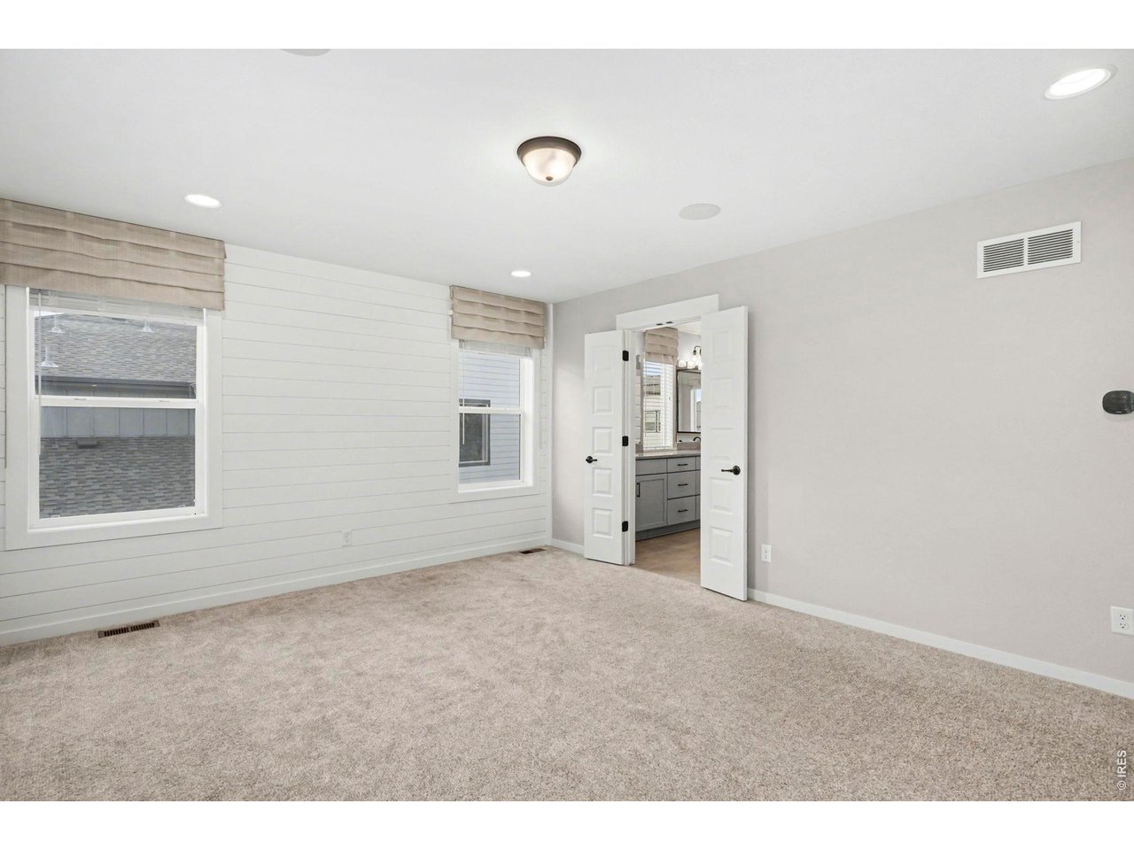 2124 Glean Court Windsor, CO 80550 - Photo 27 of 40 a view of an empty room with a window