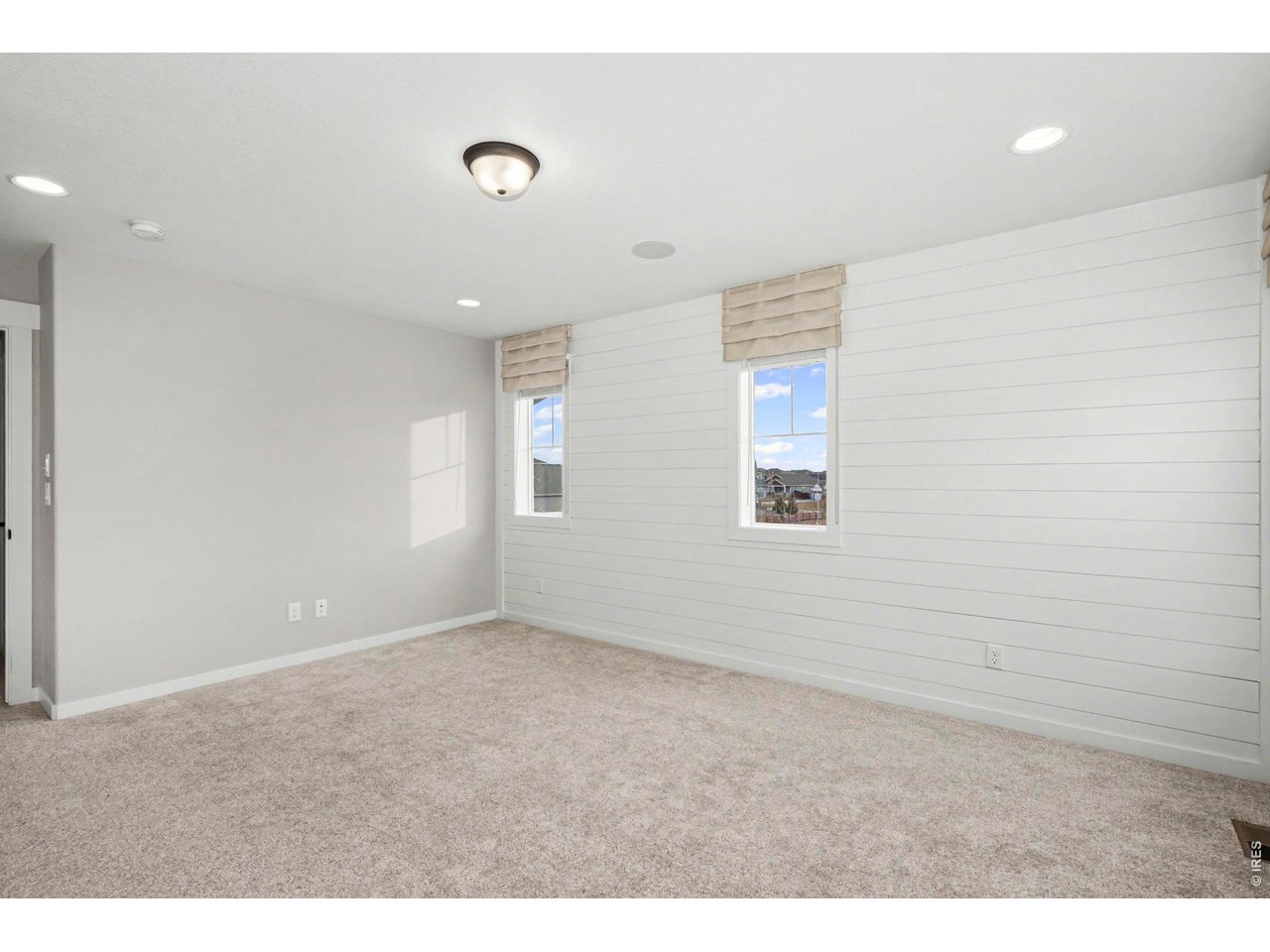 2124 Glean Court Windsor, CO 80550 - Photo 29 of 40 a view of an empty room with a window