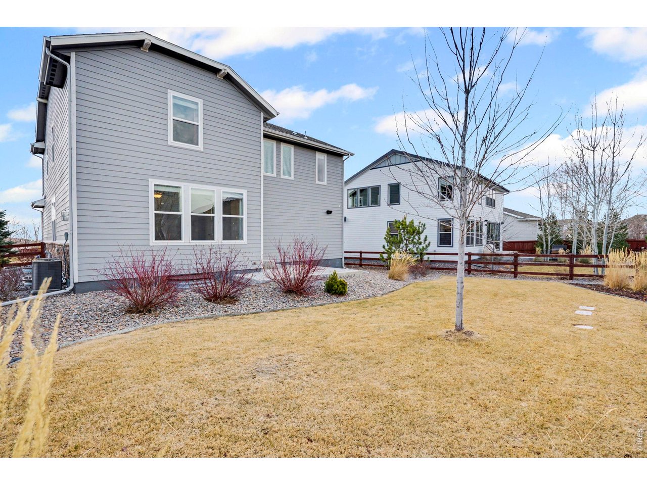 2124 Glean Court Windsor, CO 80550 - Photo 39 of 40 a swimming pool with outdoor seating and yard