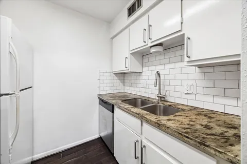 a kitchen with a stove and a microwave