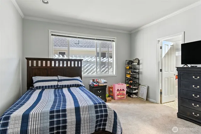 a bedroom with a bed and a tv in it