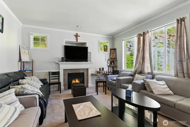 a living room with furniture fireplace and a flat screen tv