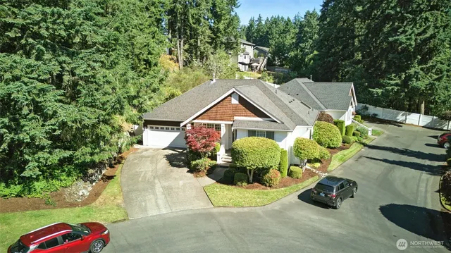 an aerial view of a house with yard swimming pool and outdoor seating