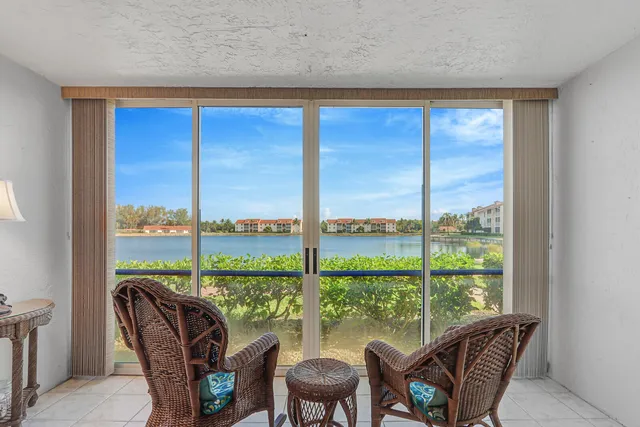 a view of a city from a dining room with large windows
