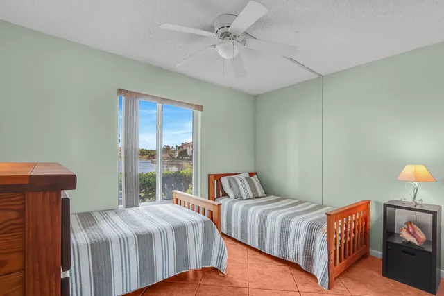 a bedroom with bed and a window