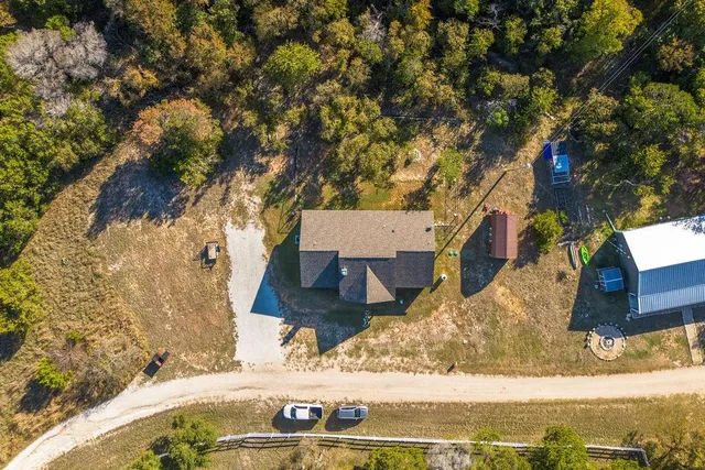 a view of a backyard of the house