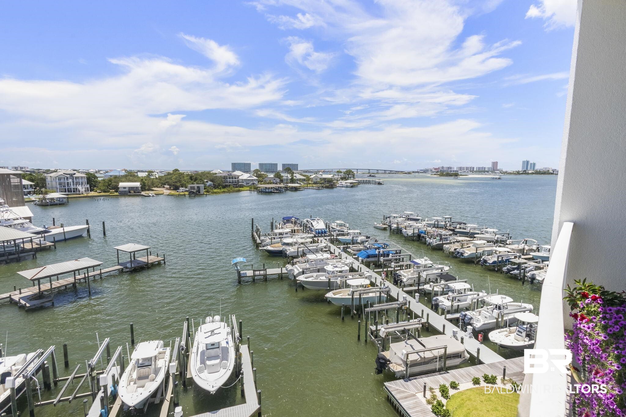 28250 Canal Road, Unit 403 Orange Beach, AL 36561 - Photo 11 of 54 Water view featuring boat lift and a boat dock
