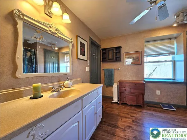 a bathroom with a sink and a mirror