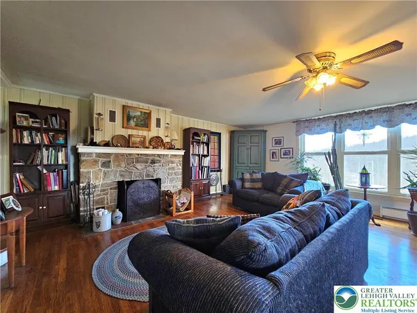 a living room with furniture and a fireplace