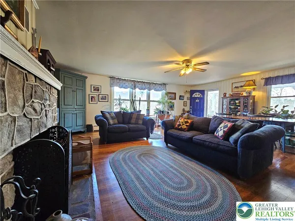 a living room with furniture and a fireplace