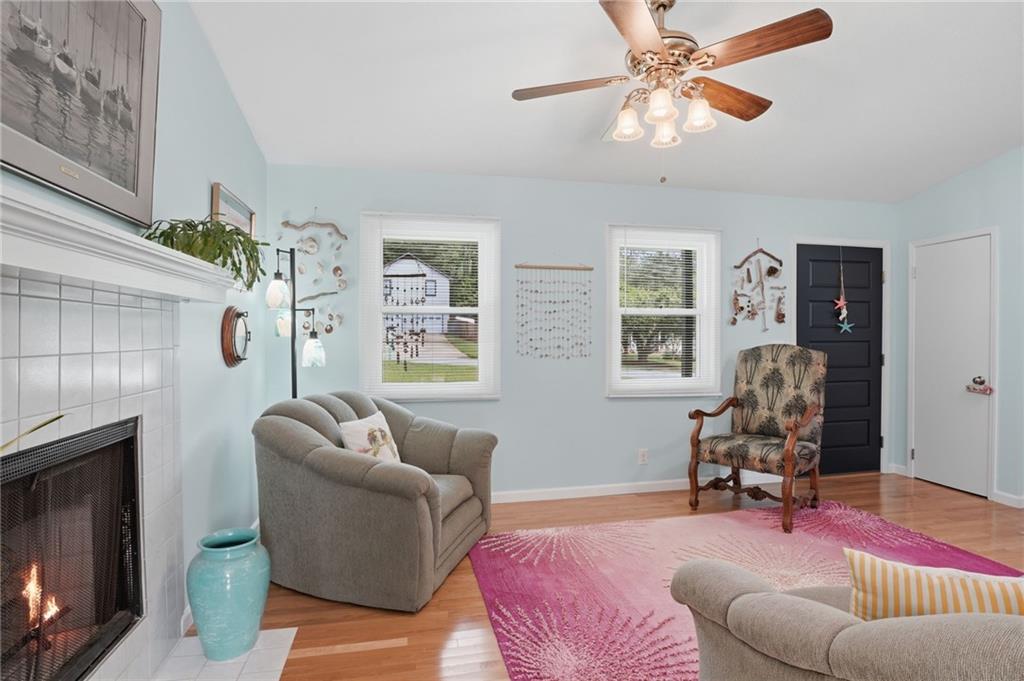 338 Arbour Way Suwanee, GA 30024 - Photo 6 of 32 a living room with furniture chess board and a fireplace