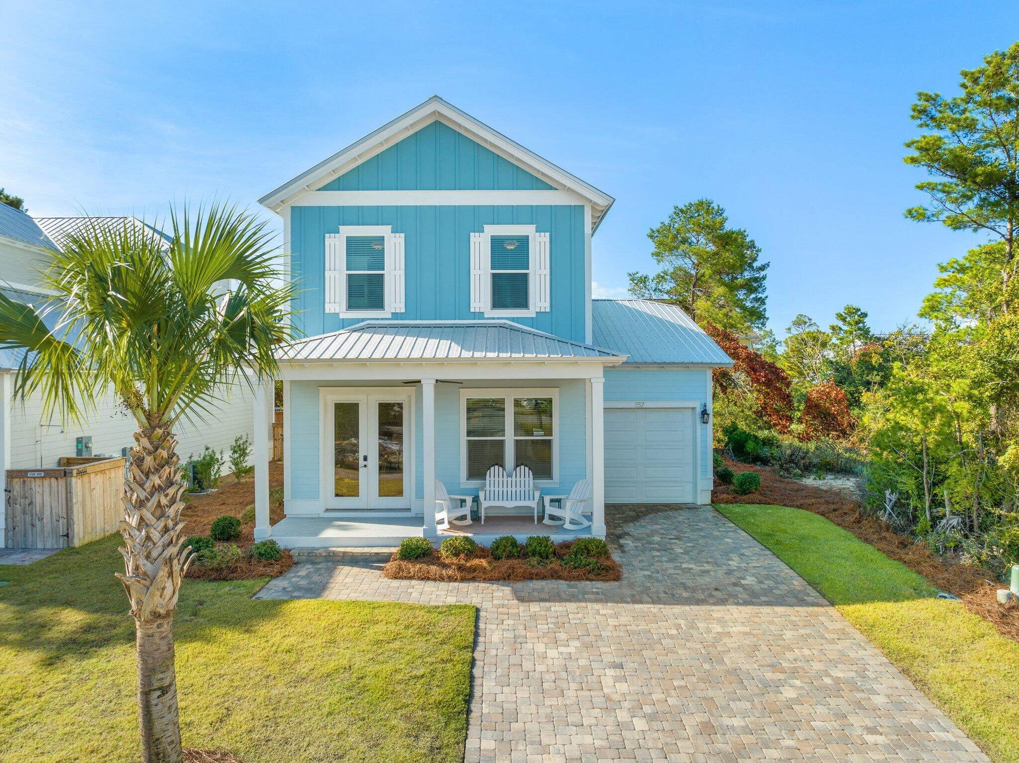 157 West Willow Mist Road Inlet Beach, FL 32461 - Photo 1 of 59 a front view of a house with garden