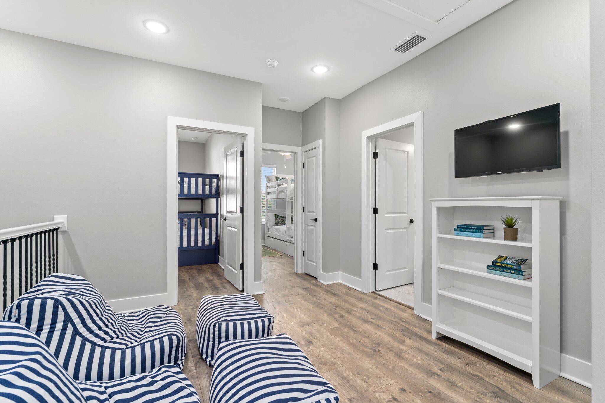 157 West Willow Mist Road Inlet Beach, FL 32461 - Photo 27 of 59 a bedroom with furniture and a flat screen tv