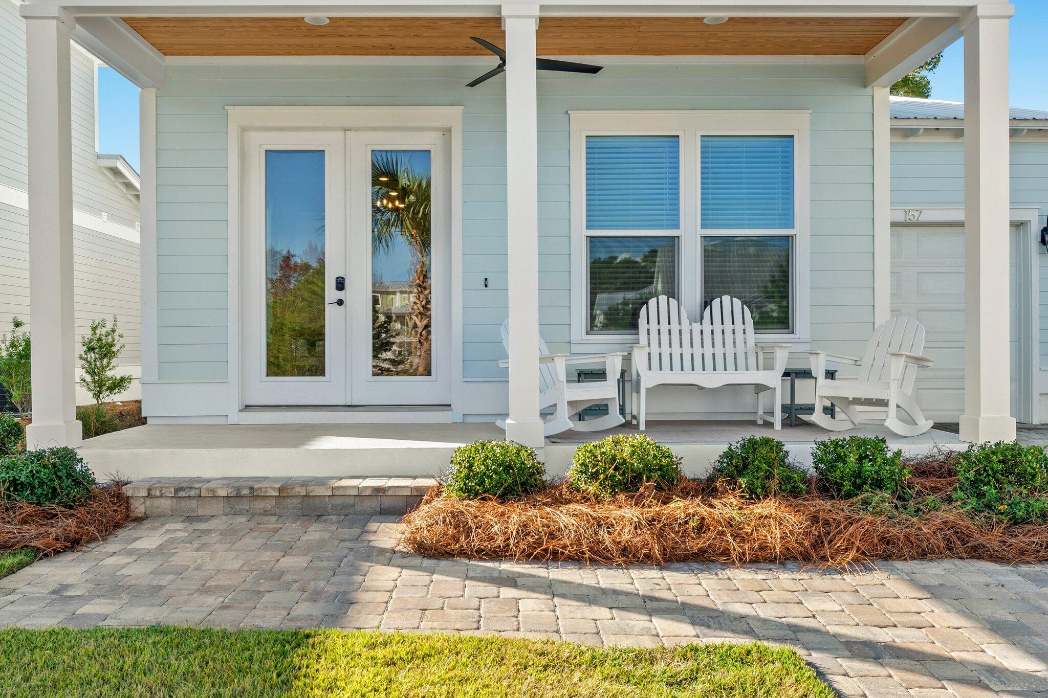 157 West Willow Mist Road Inlet Beach, FL 32461 - Photo 4 of 59 a front view of a house with a yard and potted plants