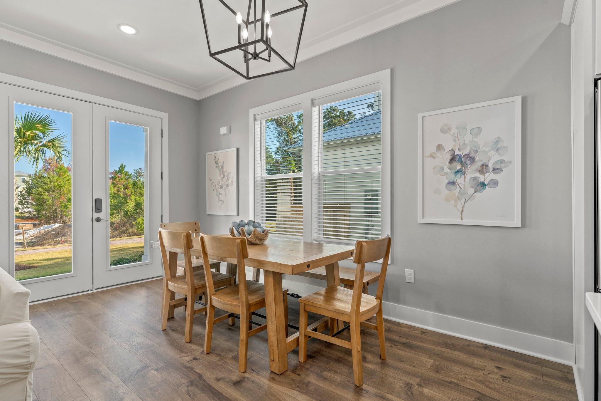 157 West Willow Mist Road Inlet Beach, FL 32461 - Photo 9 of 59 a view of a dining room with furniture window and wooden floor