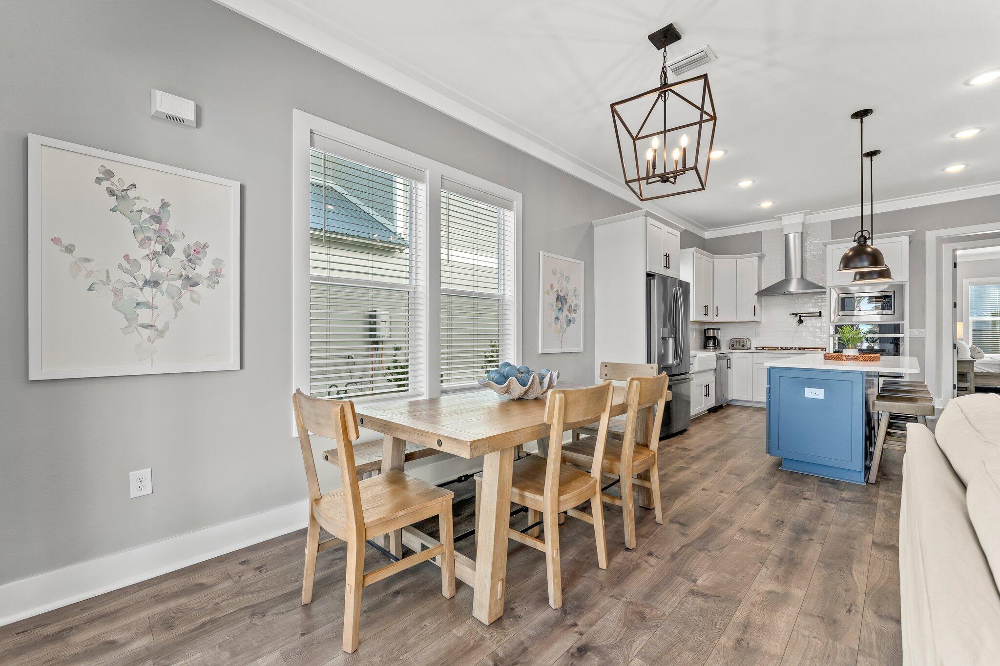 157 West Willow Mist Road Inlet Beach, FL 32461 - Photo 10 of 59 a view of a dining room with furniture window and wooden floor
