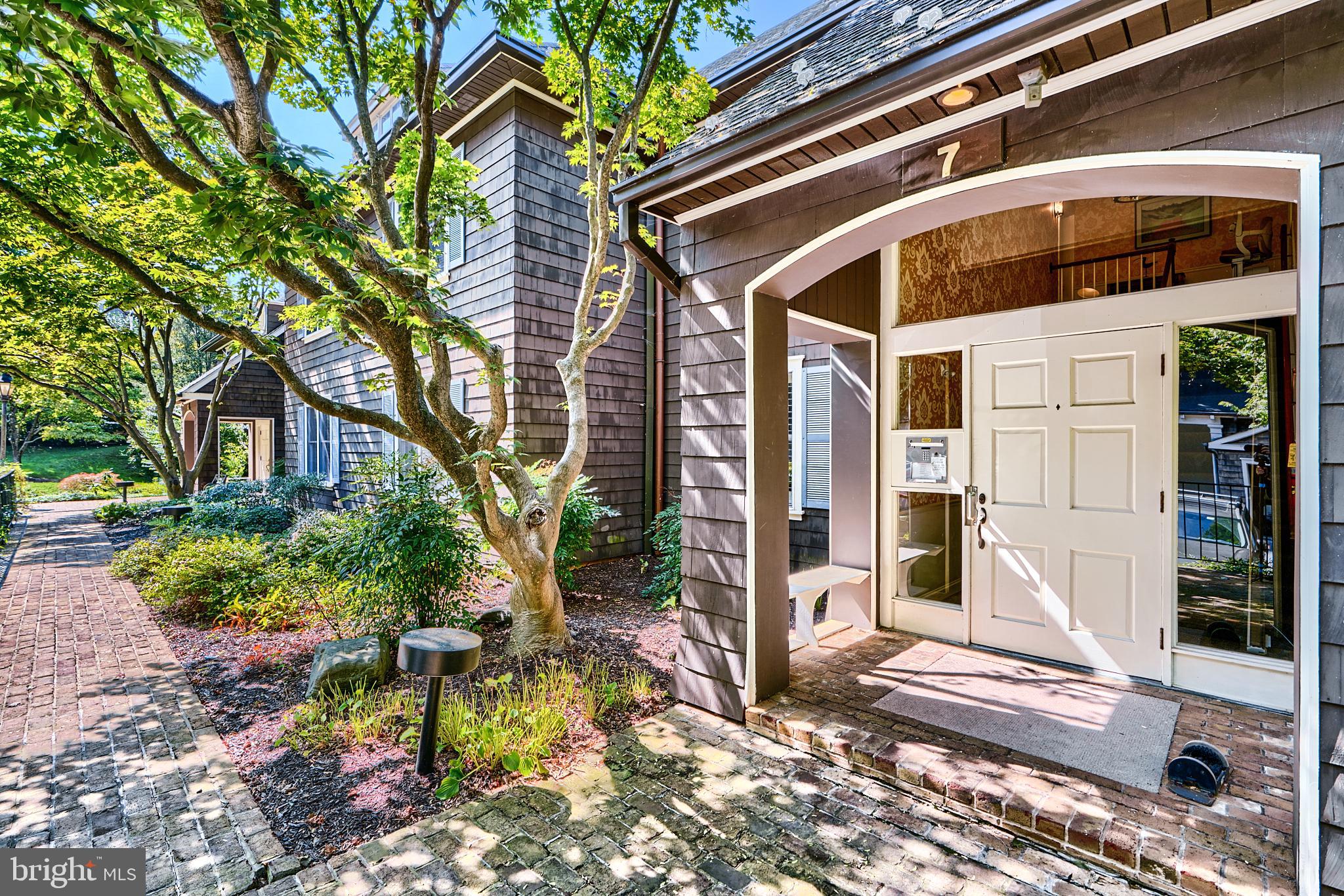 7 Devon Hill Road, Unit A6 Baltimore, MD 21210 - Photo 1 of 61 a front view of a house with a yard