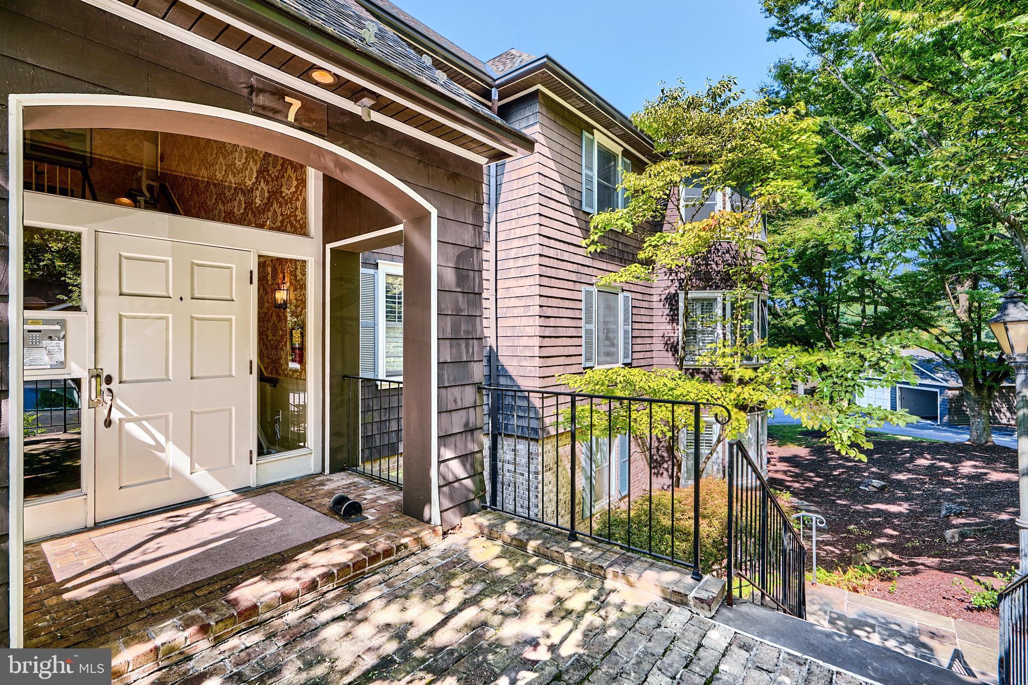 7 Devon Hill Road, Unit A6 Baltimore, MD 21210 - Photo 50 of 61 a front view of a house with a porch