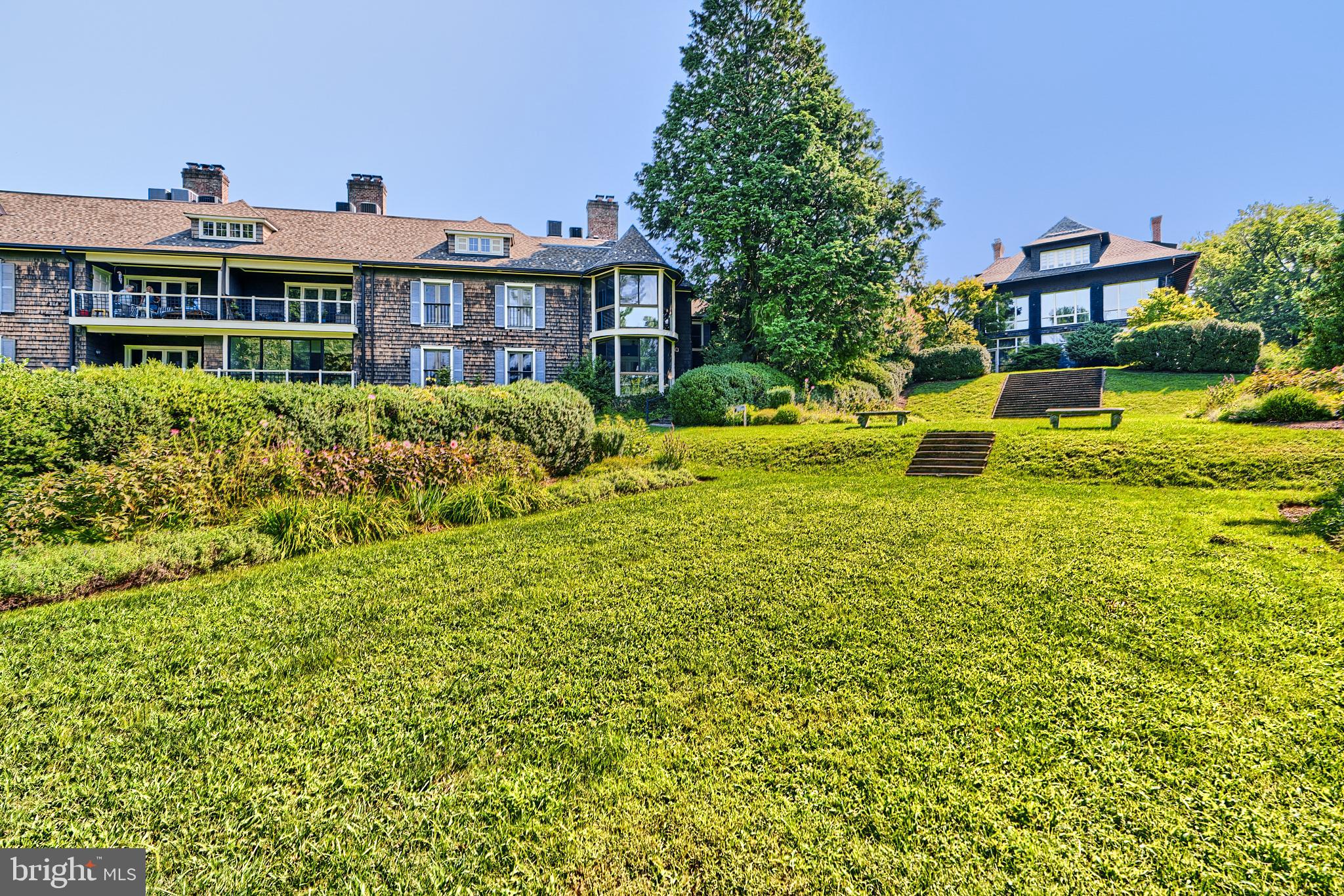 7 Devon Hill Road, Unit A6 Baltimore, MD 21210 - Photo 57 of 61 a view of a house with a garden and plants