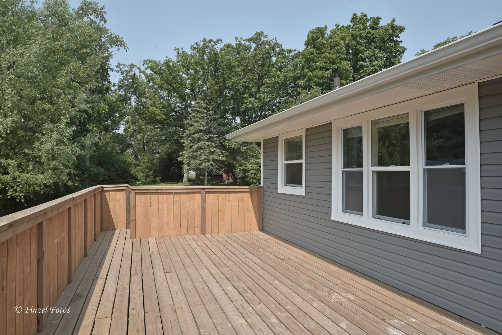 1009 Hickory Road Woodstock, IL 60098 - Photo 3 of 18 a view of backyard with deck and wooden floor