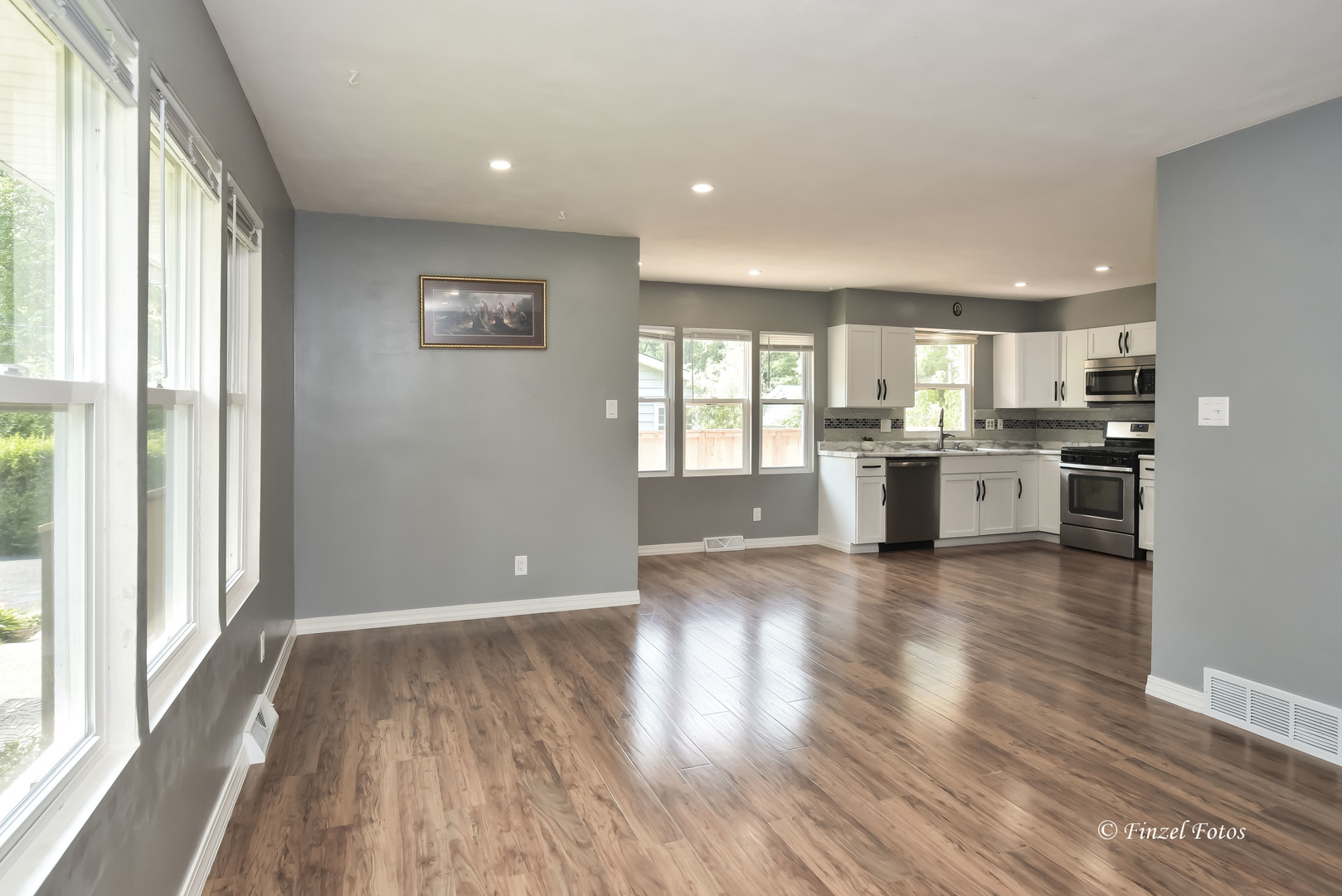1009 Hickory Road Woodstock, IL 60098 - Photo 6 of 18 a view of kitchen with wooden floor and electronic appliances