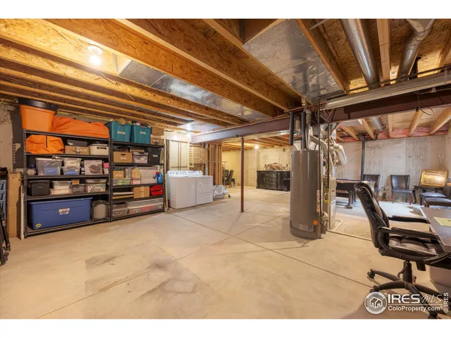 a view of a backyard with table and chairs and a barbeque