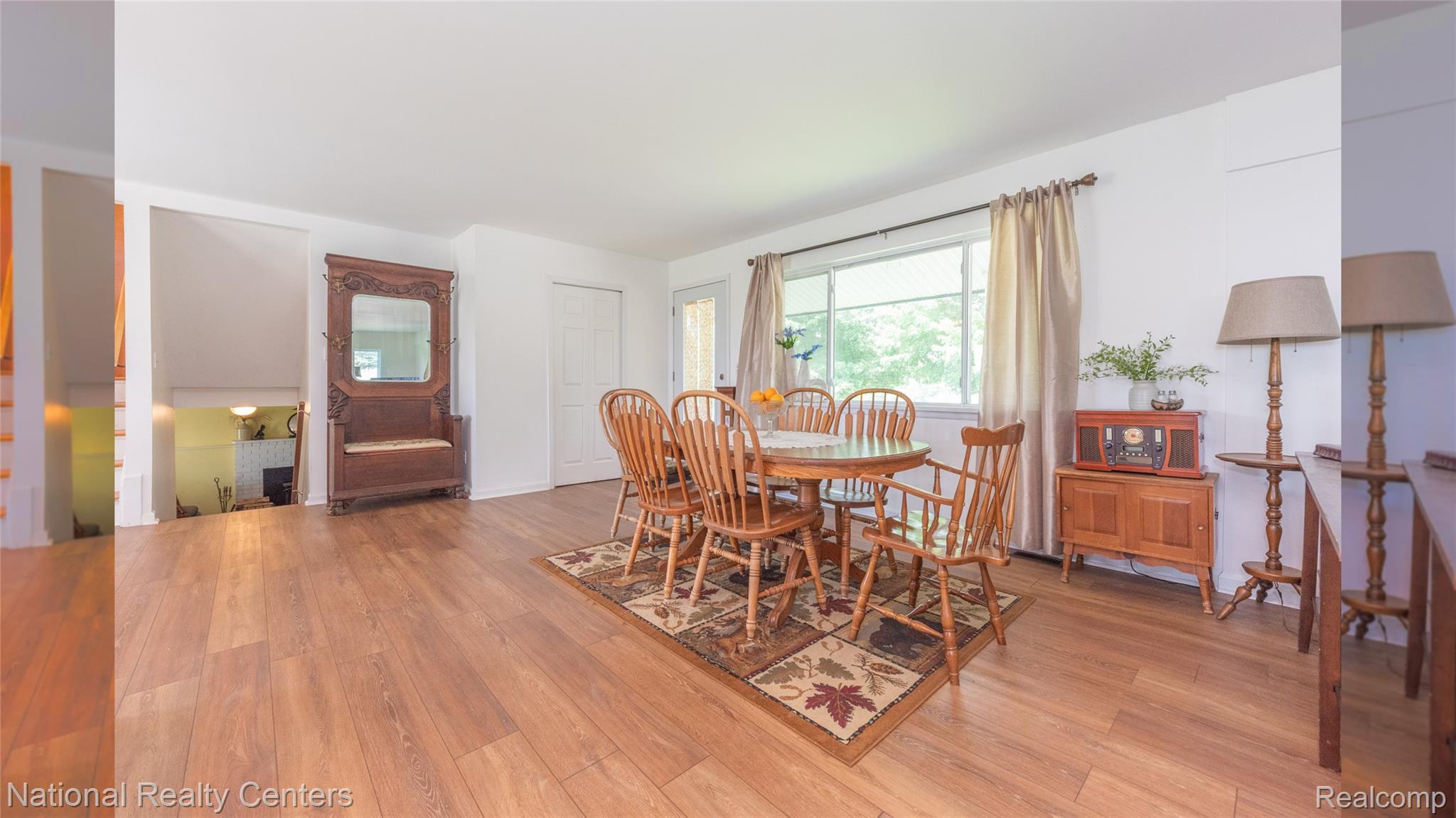 58191 8 Mile Road Northville, MI 48167 - Photo 25 of 57 Hardwood-style flooring throughout, with white painted walls and trim