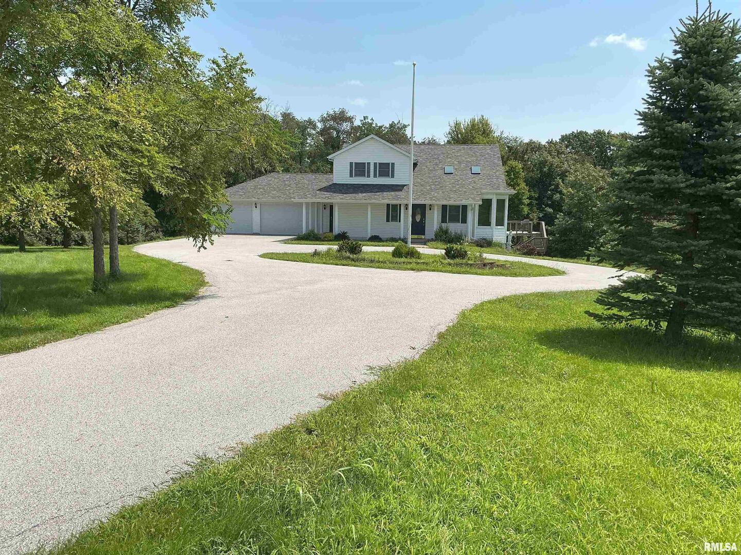 1808 106th Avenue West Milan, IL 61264 - Photo 1 of 19 a front view of a house with garden