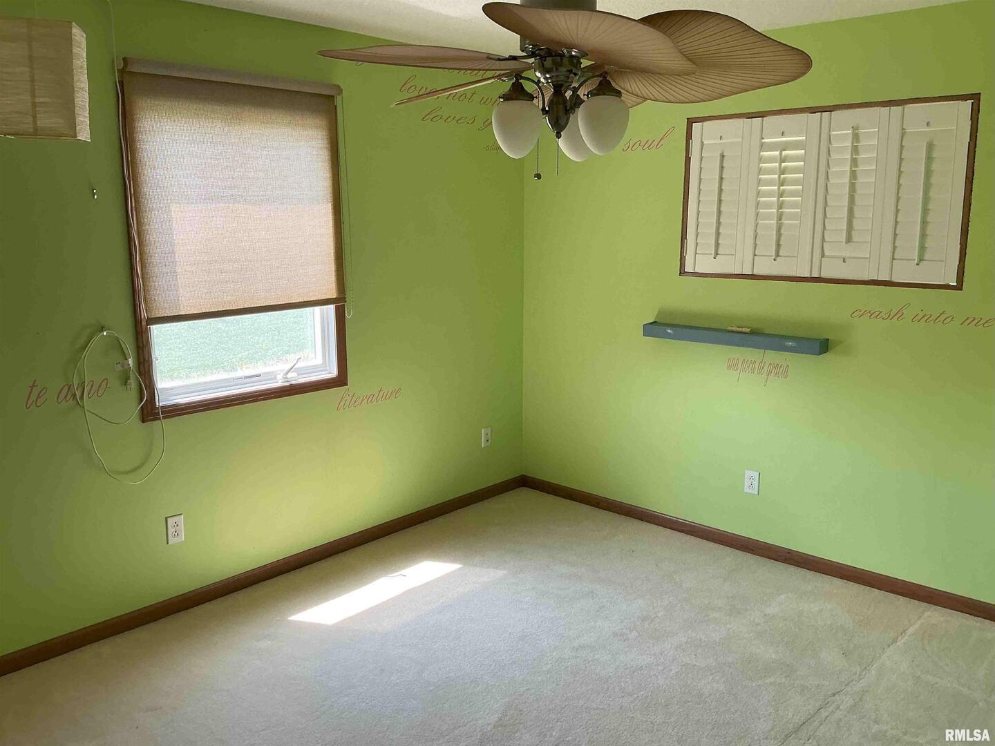 1808 106th Avenue West Milan, IL 61264 - Photo 16 of 19 a view of a room with a window and a fan