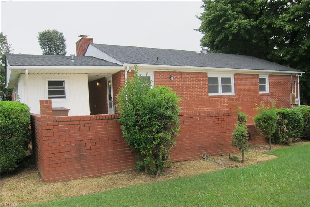 1613 Wolfe Road Greensboro, NC 27405 - Photo 2 of 16 Back Of Home Private Brick Patio.