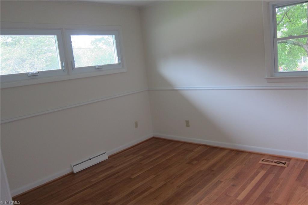 1613 Wolfe Road Greensboro, NC 27405 - Photo 12 of 16 Second Bedroom...Refinished Floors...New Windows.