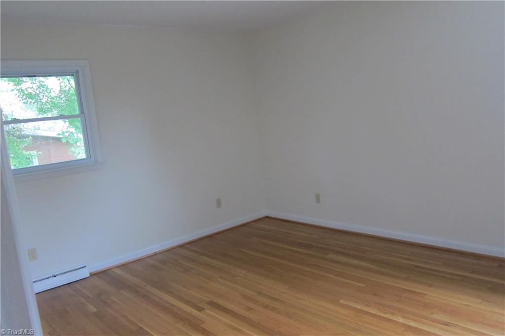 1613 Wolfe Road Greensboro, NC 27405 - Photo 13 of 16 Master Bedroom with Refinished Hardwoods.