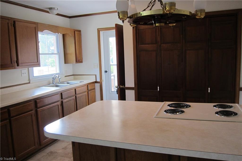 1613 Wolfe Road Greensboro, NC 27405 - Photo 6 of 16 View of the Kitchen...Refinished Cabinets...New sink and faucets...Large Pantry!