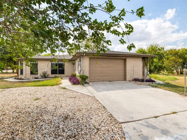 a house view with a backyard space