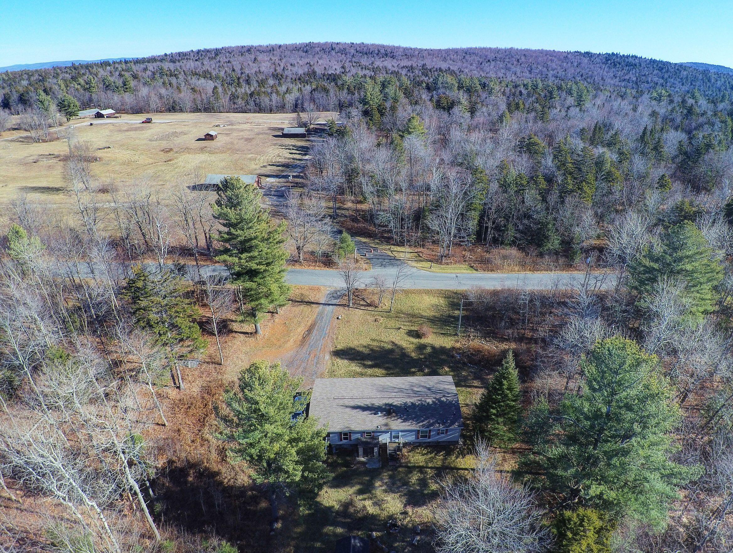 548 Loop Road Savoy, MA 01256 - Photo 12 of 12 a view of a lake with mountains in the background