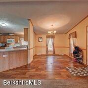 548 Loop Road Savoy, MA 01256 - Photo 3 of 12 a view of empty room with wooden floor