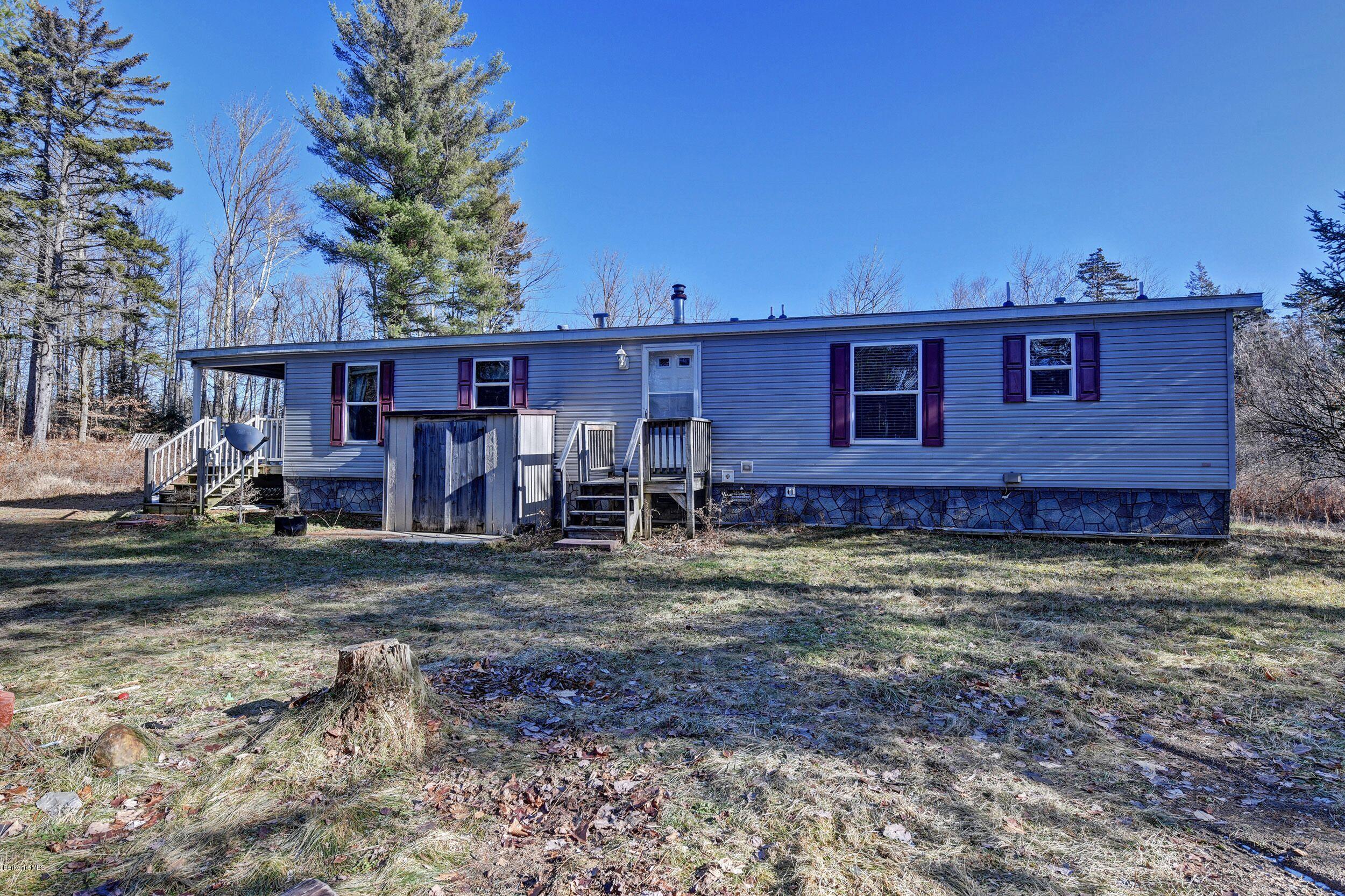 548 Loop Road Savoy, MA 01256 - Photo 9 of 12 a view of a house with a yard