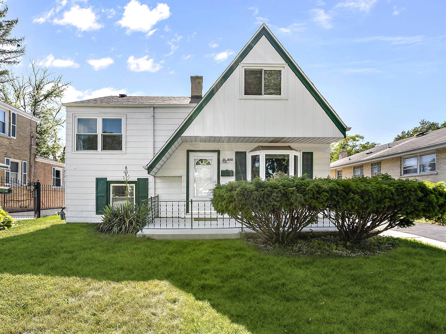 860 Spring Road Elmhurst, IL 60126 - Photo 1 of 17 a front view of a house with a garden