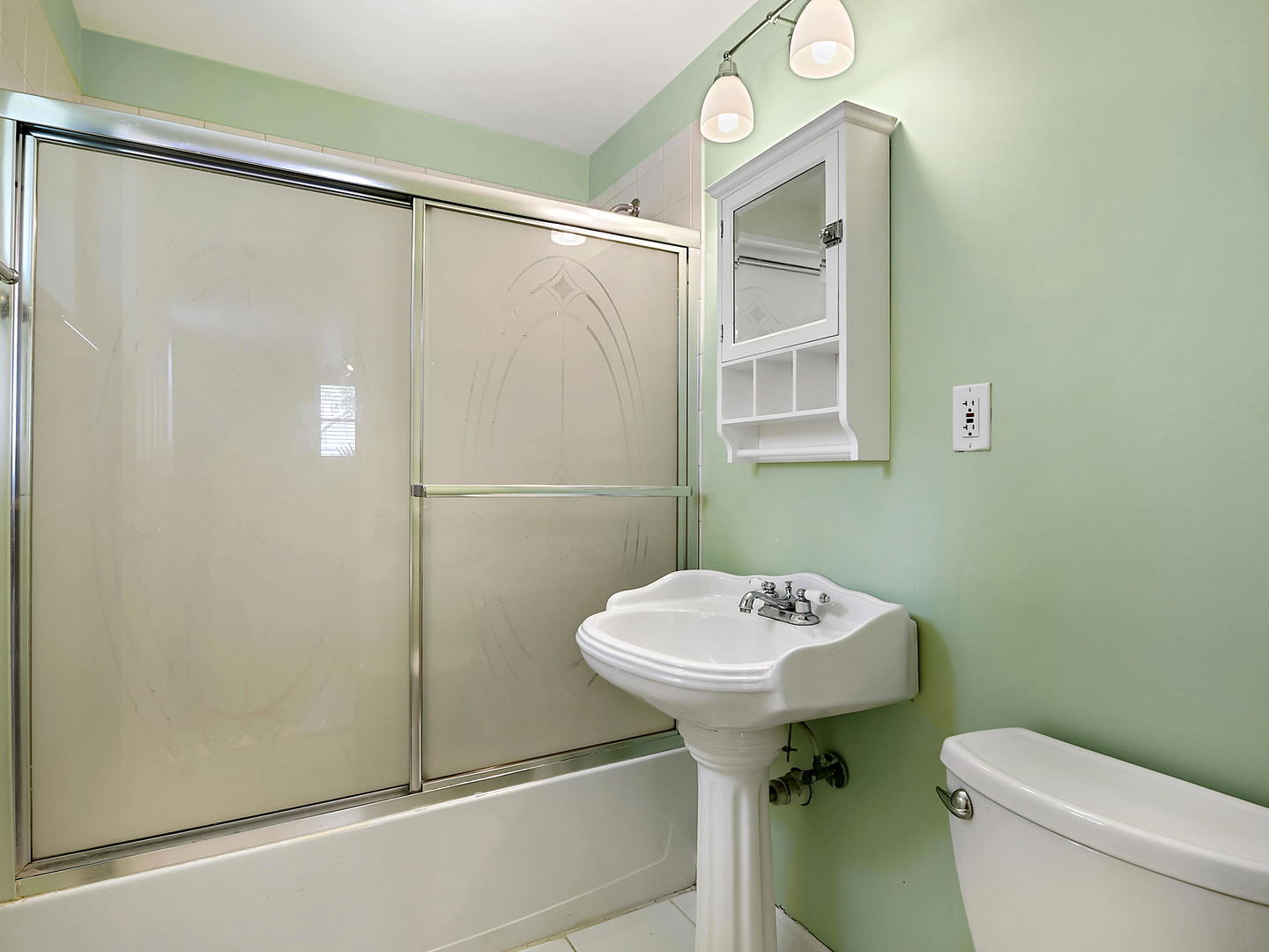 860 Spring Road Elmhurst, IL 60126 - Photo 14 of 17 a bathroom with a sink a toilet and shower