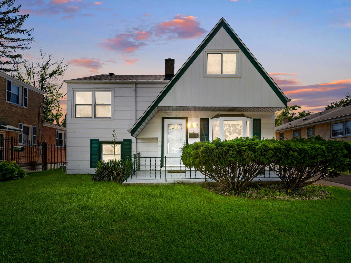 860 Spring Road Elmhurst, IL 60126 - Photo 17 of 17 a front view of a house with a garden