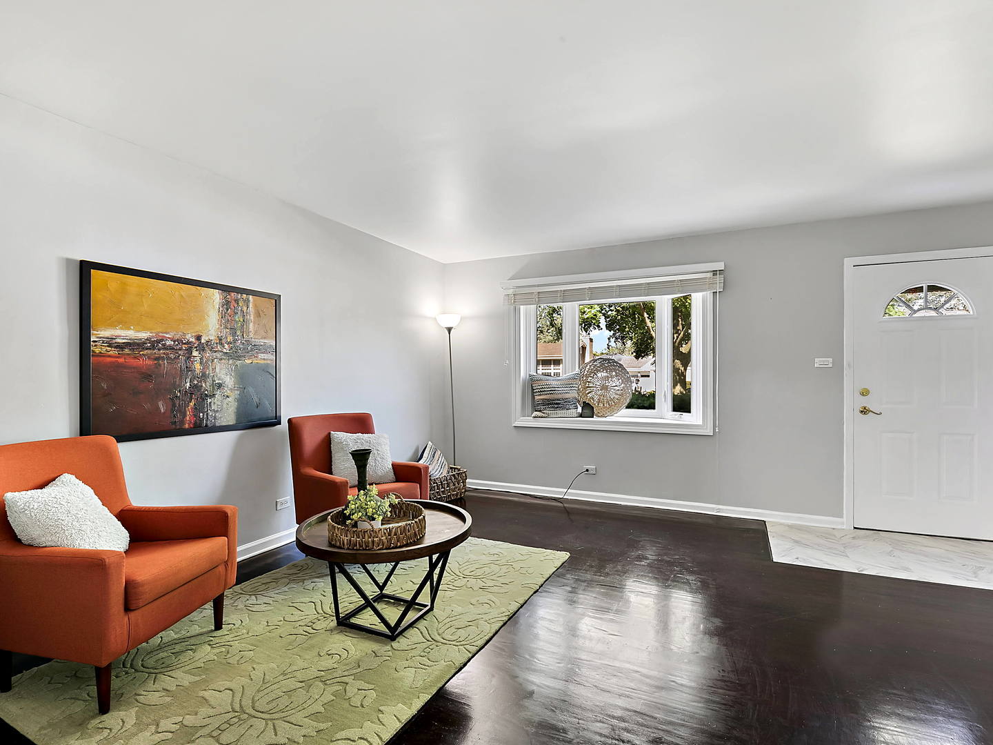 860 Spring Road Elmhurst, IL 60126 - Photo 5 of 17 a living room with furniture a rug and a window