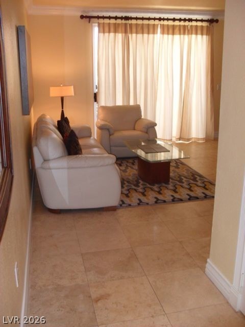 270 East Flamingo Road, Unit 436 Las Vegas, NV 89169 - Photo 11 of 19 This inviting living space features expansive windows and tiled flooring for a bright, comfortable atmosphere.