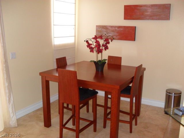270 East Flamingo Road, Unit 436 Las Vegas, NV 89169 - Photo 2 of 19 This bright dining area features an elegant wooden table, perfect for intimate gatherings.