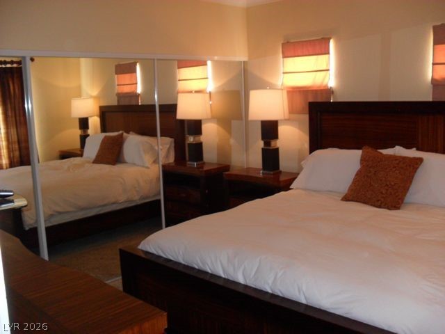 270 East Flamingo Road, Unit 436 Las Vegas, NV 89169 - Photo 6 of 19 This inviting bedroom provides a comfortable retreat with warm lighting and a spacious feel.