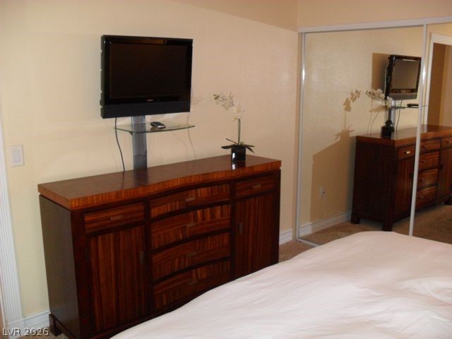 270 East Flamingo Road, Unit 436 Las Vegas, NV 89169 - Photo 7 of 19 This restful bedroom features a rich wooden dresser with ample storage.